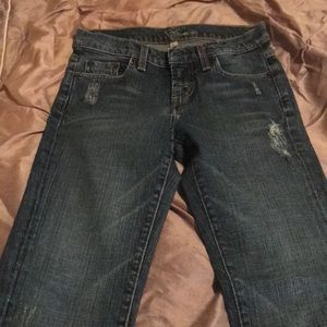 BEBE jeans with red “B” on each back pocket.